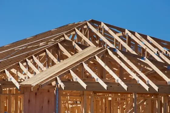 A timber roof structure under construction